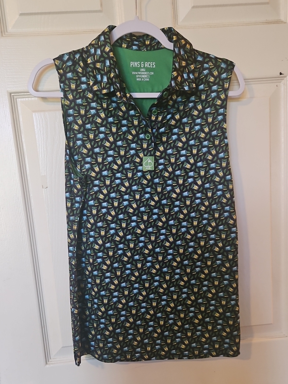 Pins & Aces Sleeveless Golf Polo in Black with Blue & Green Print Limes & Drinks